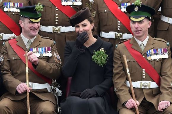 Duchess of Cambridge giggles during group photo (Photo: Getty)